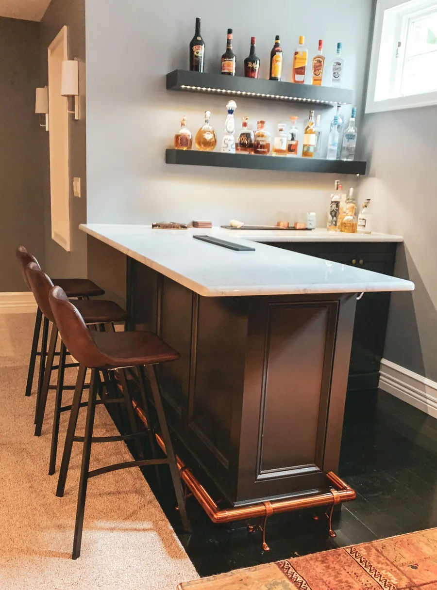 Lower level bar with backlit shelving
