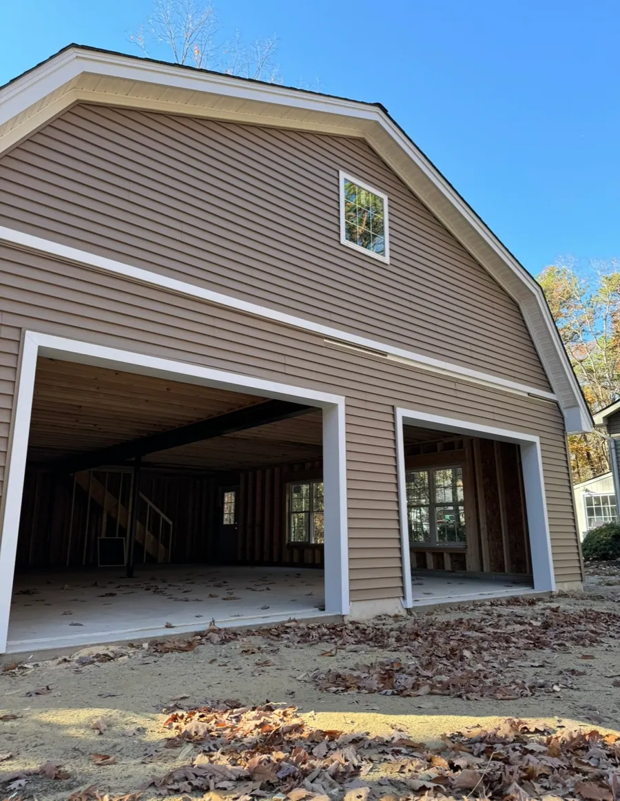 Gambrel roofed barn garage with double doors