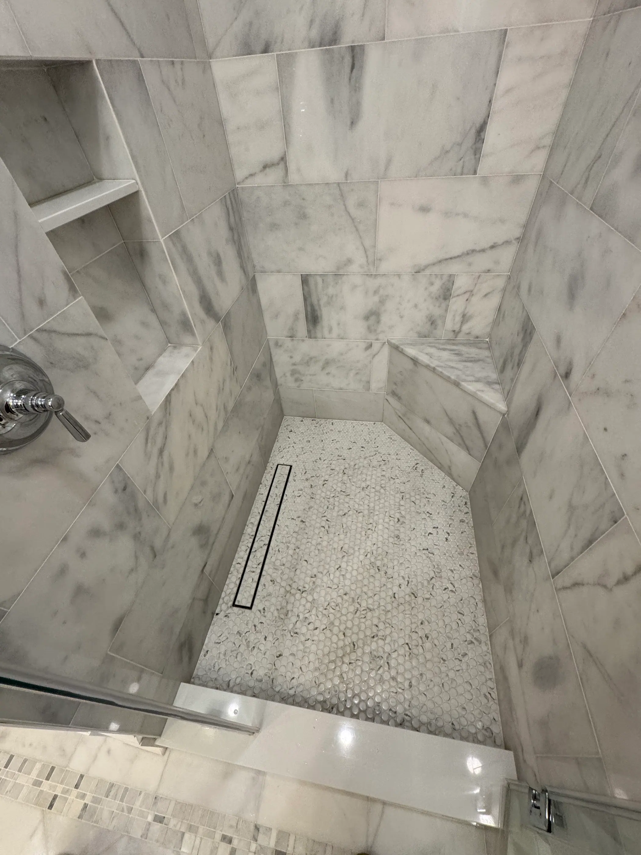 Marble shower wall with a built in niche