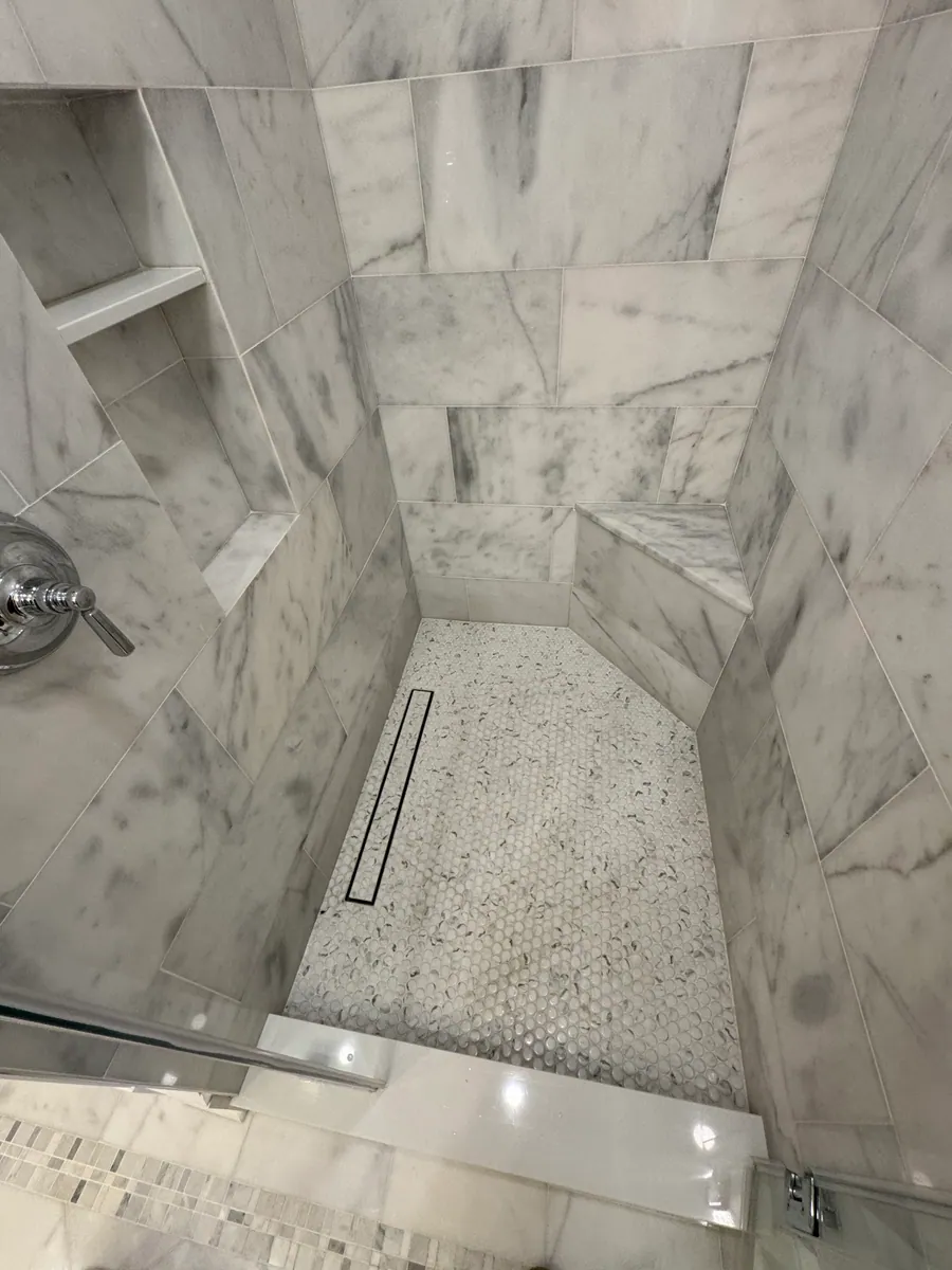 Marble shower wall with a built in niche