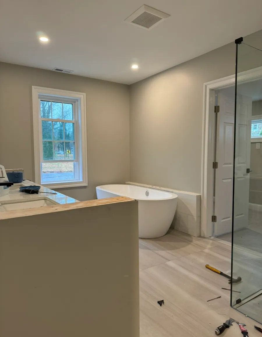 Primary bathroom with a freestanding tub and glass shower