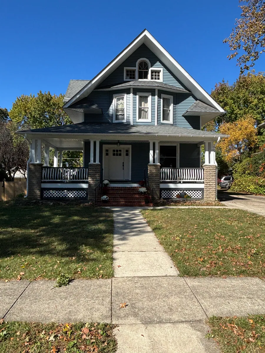Craftsman home with a covered porch and tapered columns