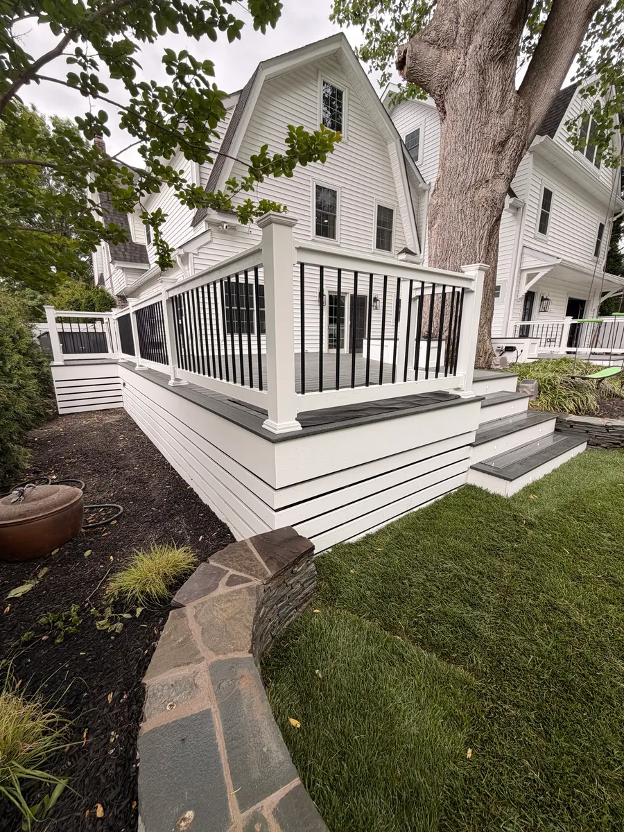 White deck along the rear of a home