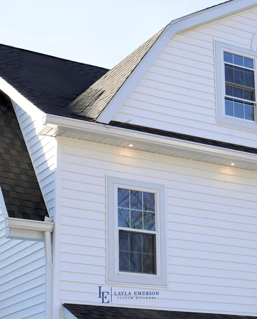 White gambrel roof with dormer windows