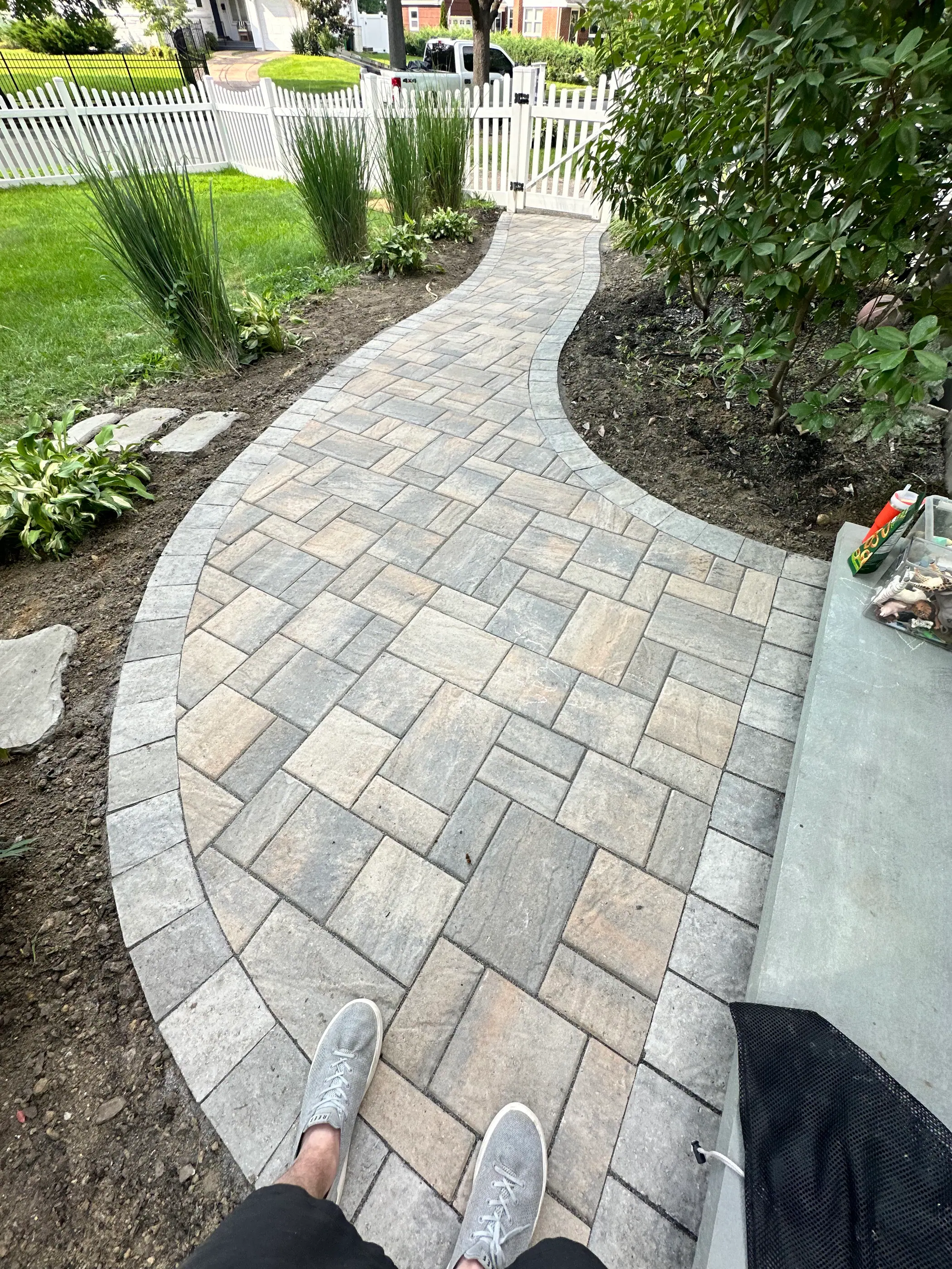 Paver walkway leading to a front entry