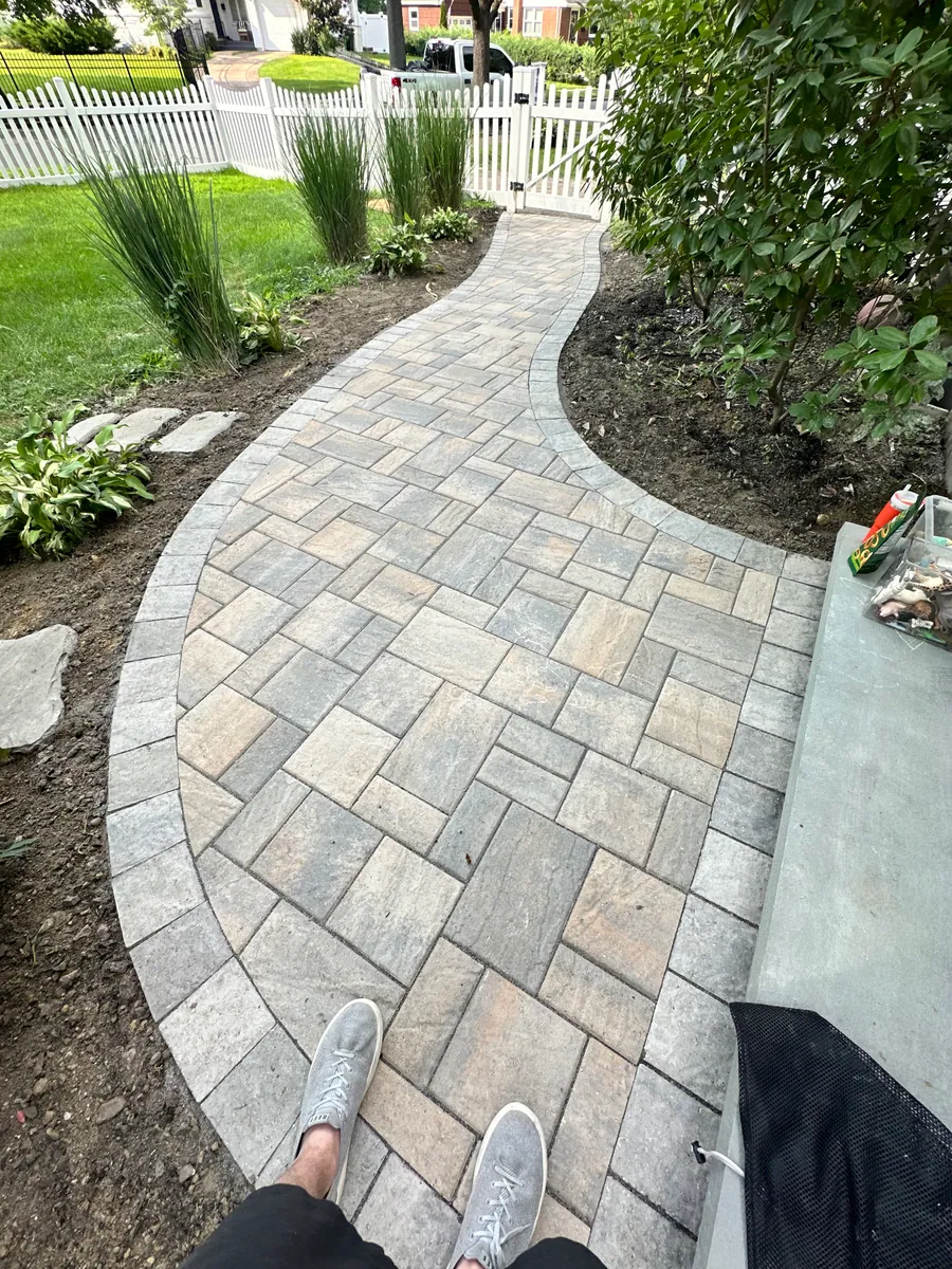 Paver walkway leading to a front entry