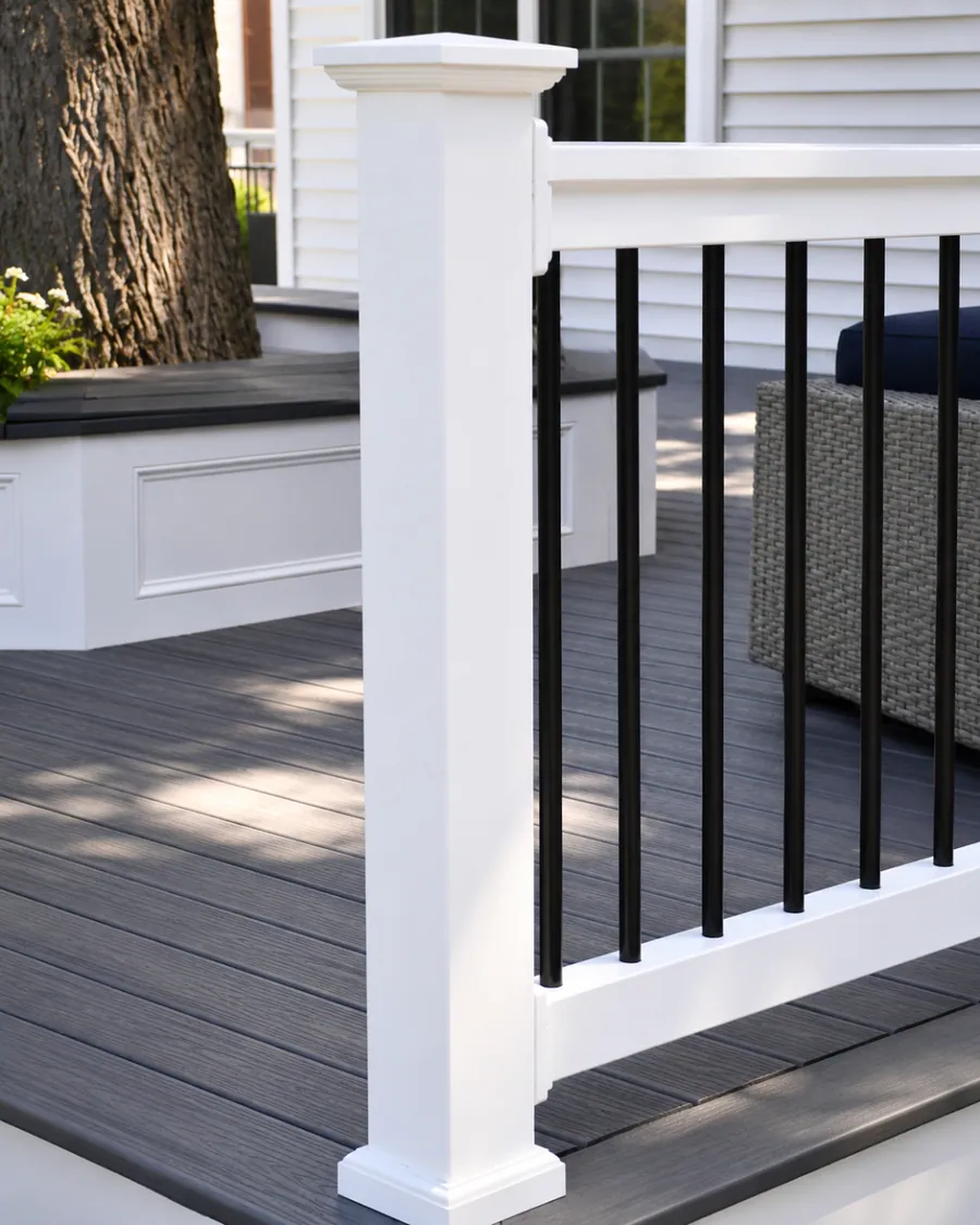 Deck railing detail with a wood cap