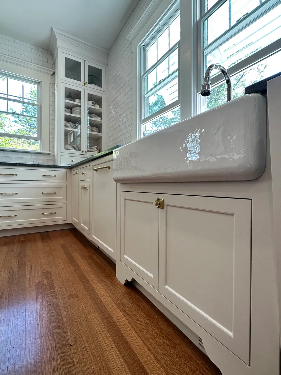 Kitchen with an apron front sink under a window