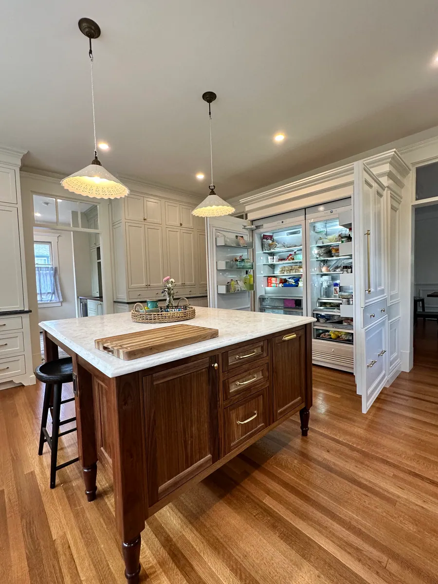 Kitchen with a full wall of pantry cabinetry