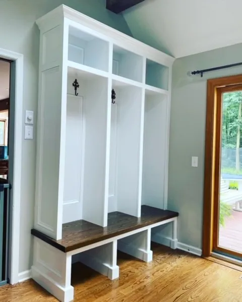 Mudroom lockers with hooks and a bench