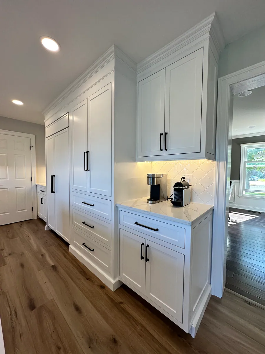White cabinetry coffee station with open shelving