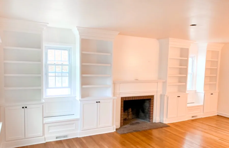White built ins flanking a fireplace