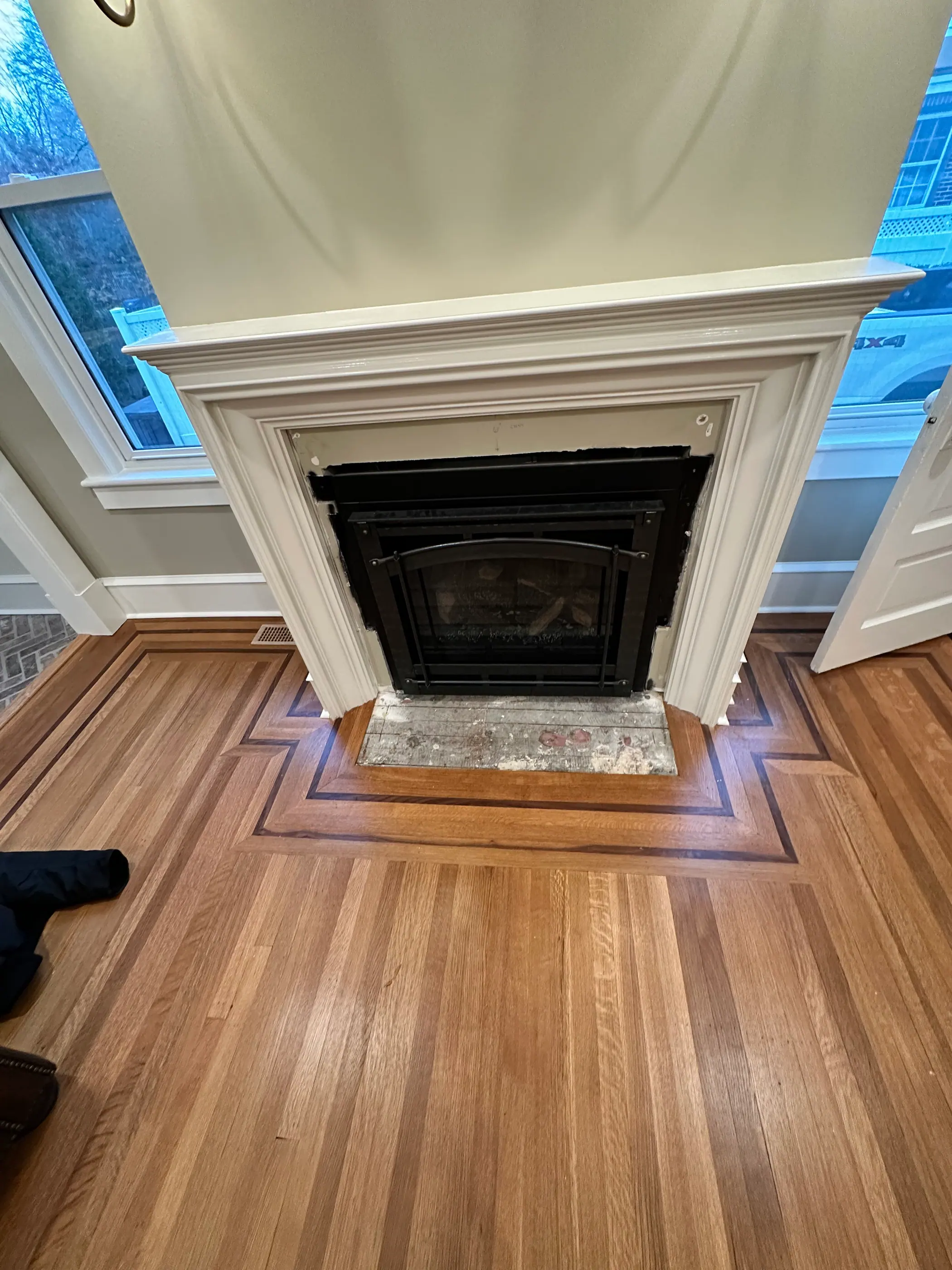 Fireplace mantel with a marble surround and hearth