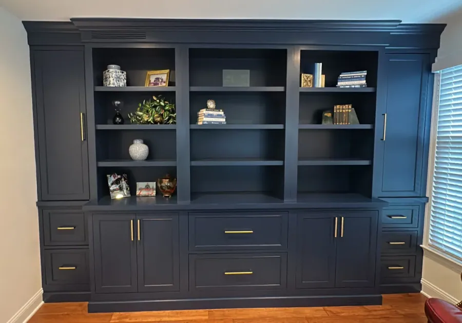 Navy built in hutch with glass doors and brass pulls