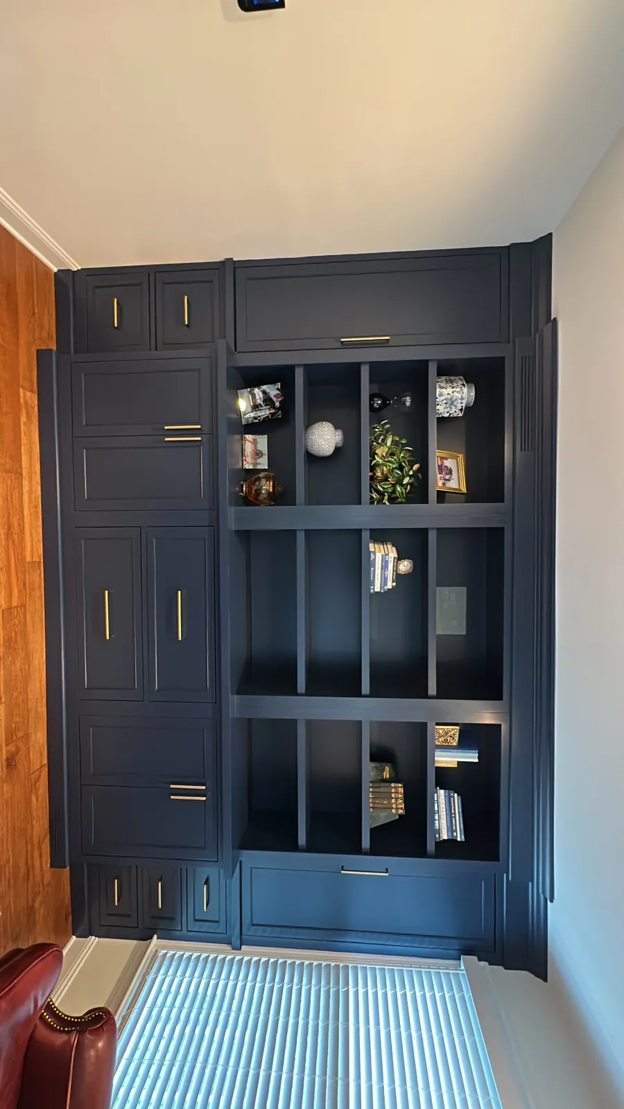 Navy hutch with glass doors and interior lighting