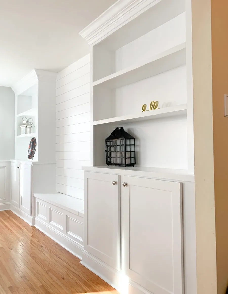 Built in niche with shiplap backing and painted cabinets
