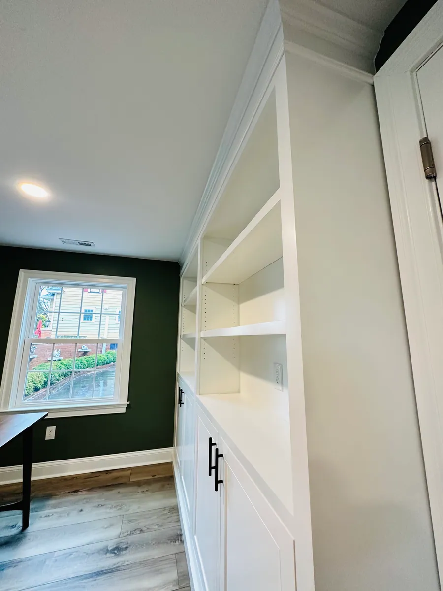 White built in shelving flanking a doorway