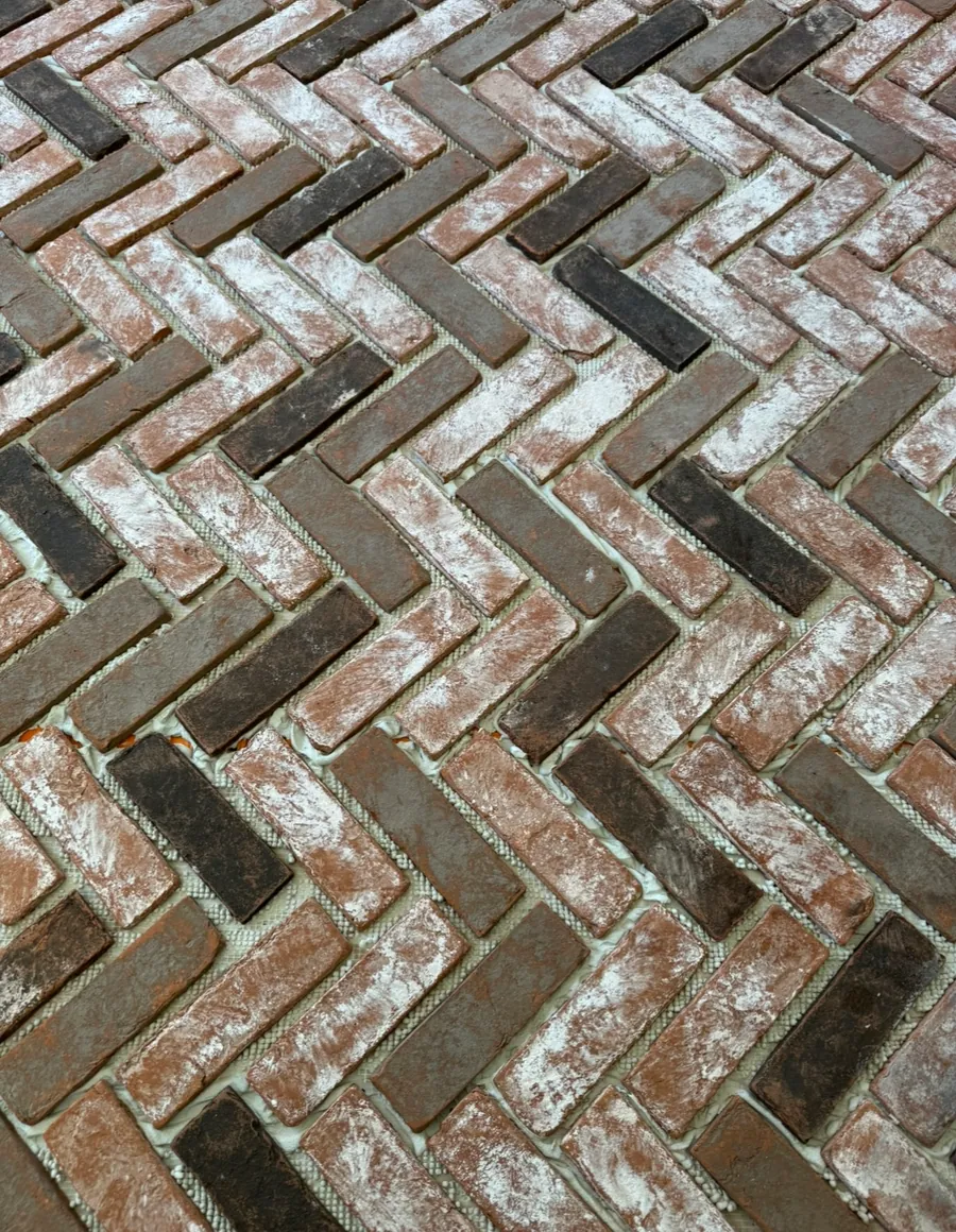 Finished brick herringbone floor