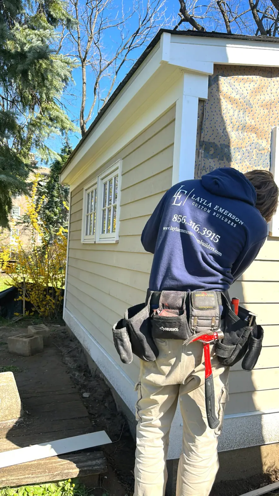Crew member working on an exterior wall