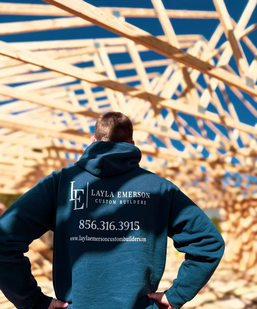 Crew member under new roof trusses