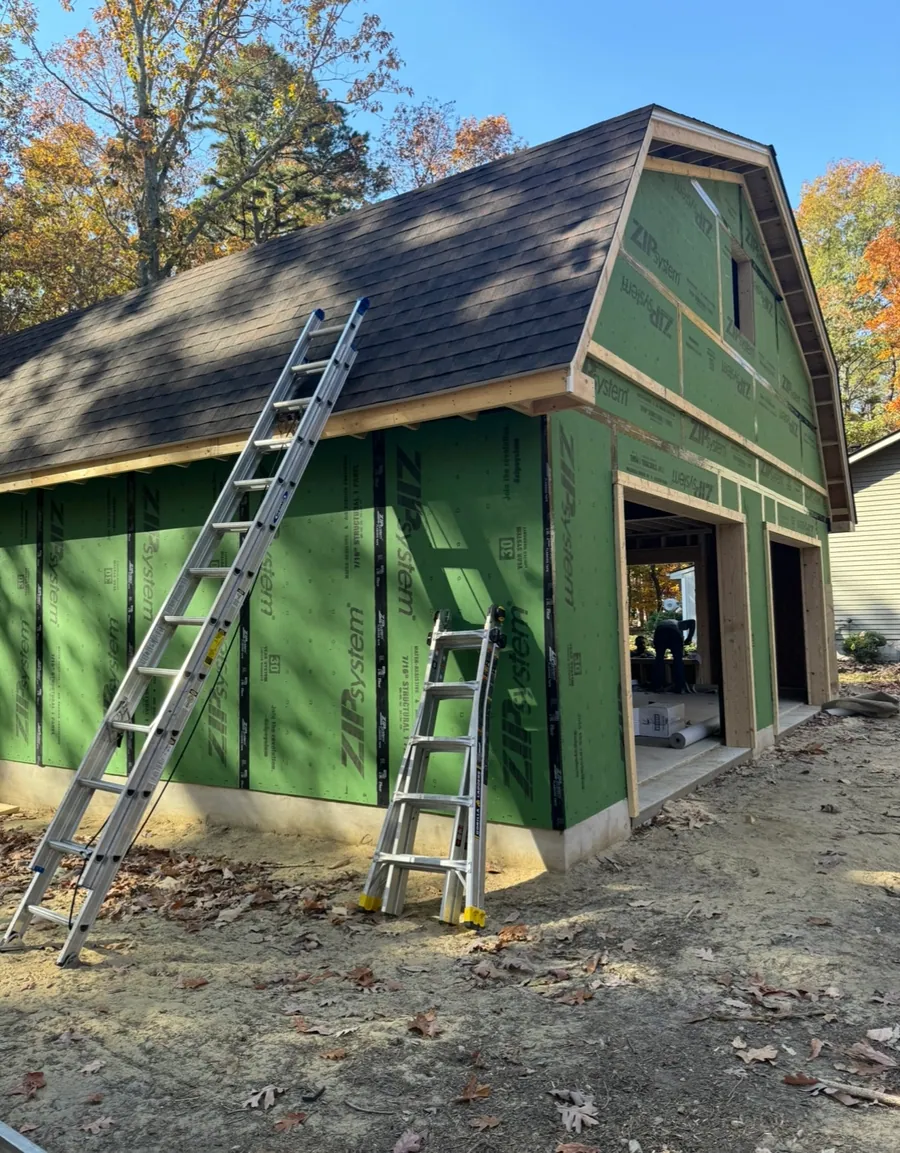 Crew working on a gambrel roof