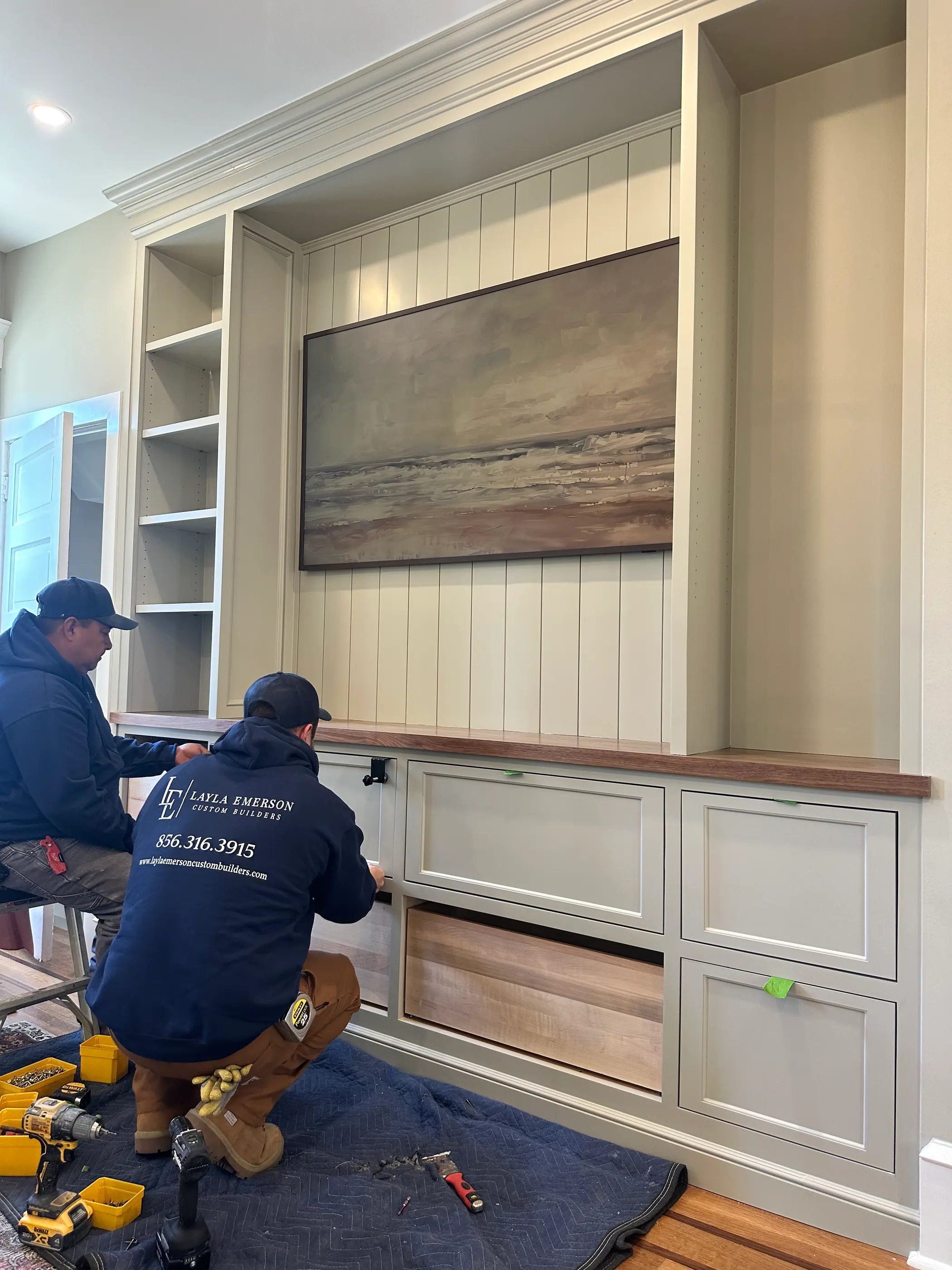 Crew installing a built in cabinet