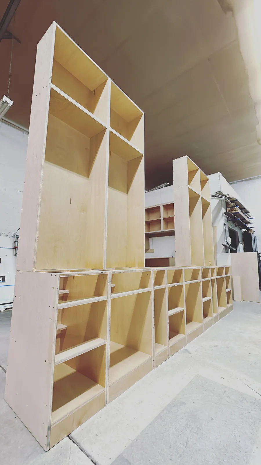 Cabinet carcasses stacked in the shop