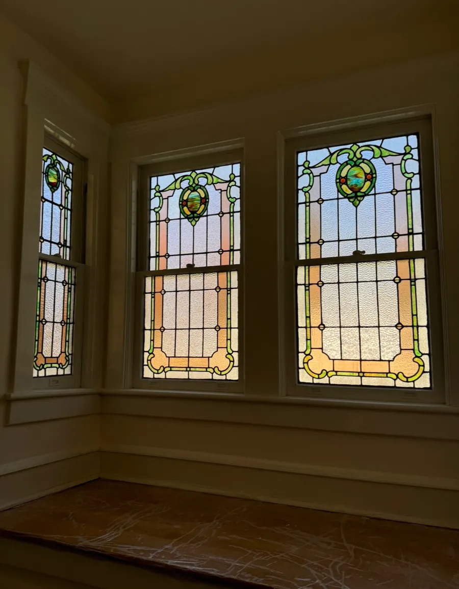 Restored stained glass windows in a bay