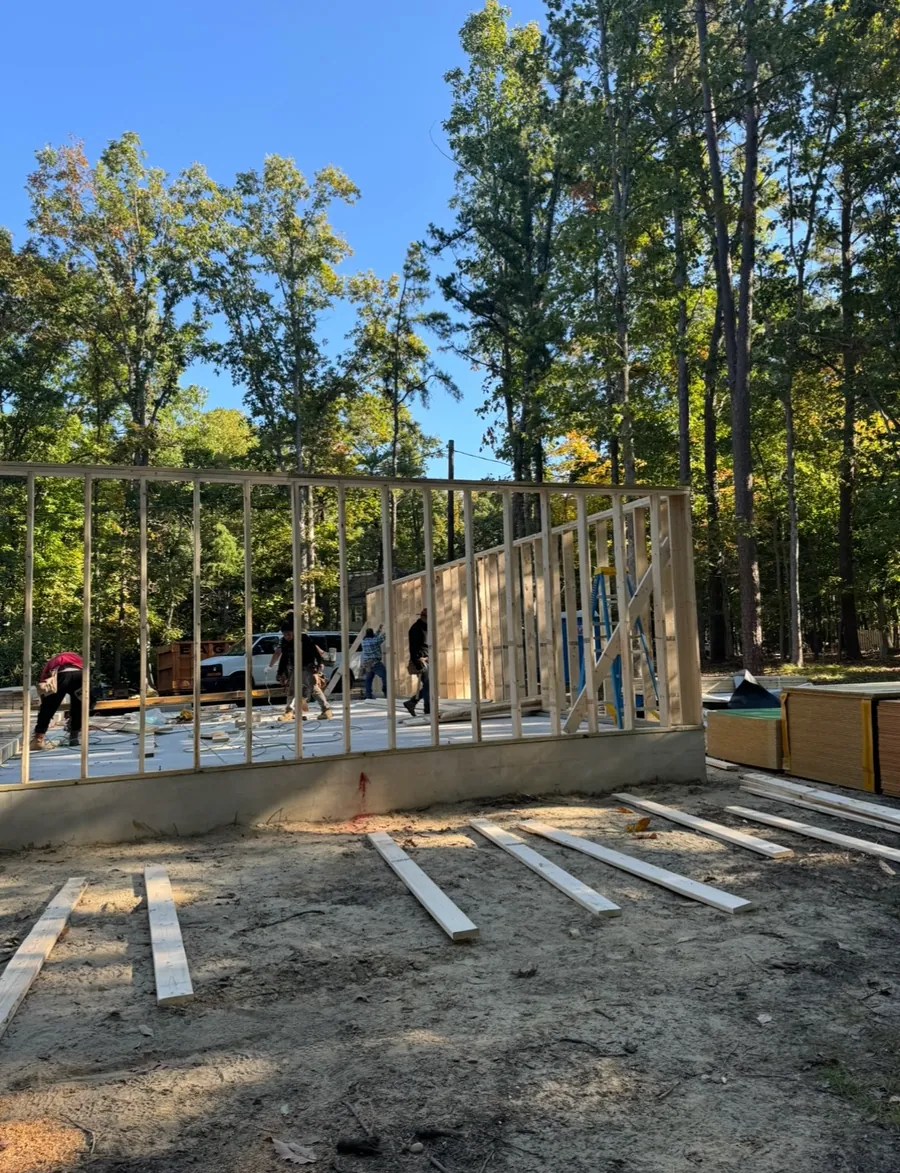 Framed wall being raised on a new build